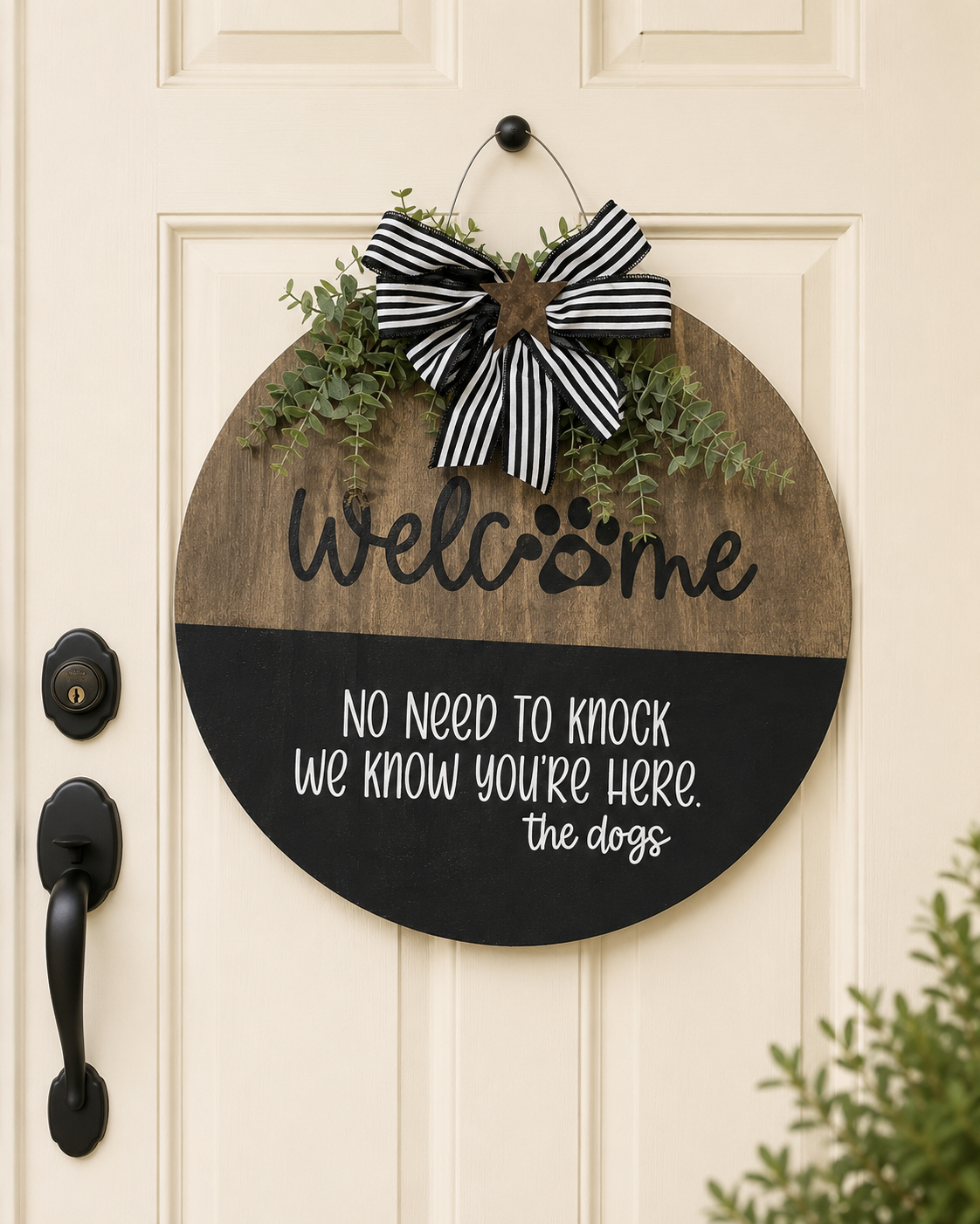 The Dogs Welcome Sign